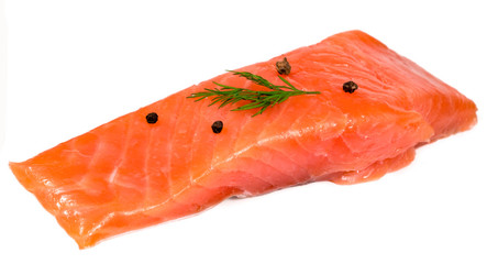 .red fish with herbs and pepper on white background