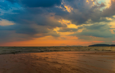 Fototapeta na wymiar sunset at the beach. The beauty of a tropical beach Thailand sunrise at the beach. beach sand Ao Nang, Krabi, Thailand