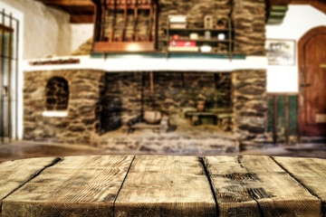 Desk of free space and fireplace in home interior. Wild west background. 