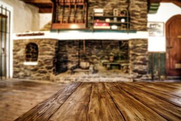 Desk of free space and fireplace in home interior. Wild west background. 
