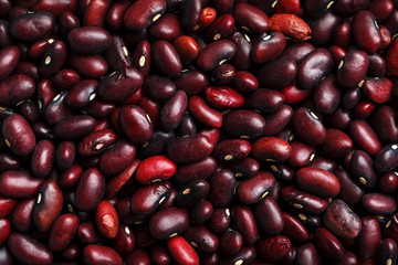 Closeup of a grain of red bean seeds. The texture of the legumes. Close up red beans background, seeds of red beans