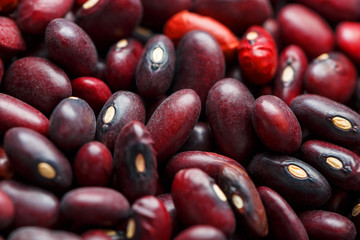 Closeup of a grain of red bean seeds. The texture of the legumes. Close up red beans background, seeds of red beans