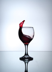 stream of wine being pouring into a glass closeup