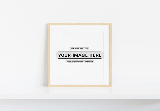 Square Wooden Frame on White Shelf Mockup