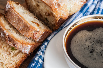 Coffee and cakes on a wooden table background