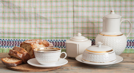 Coffee and cakes on a wooden table background