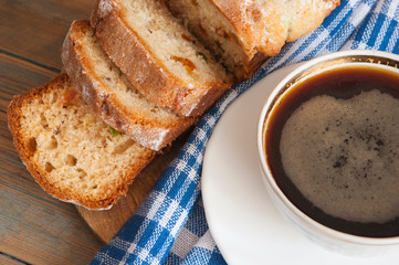 Coffee and cakes on a wooden table background