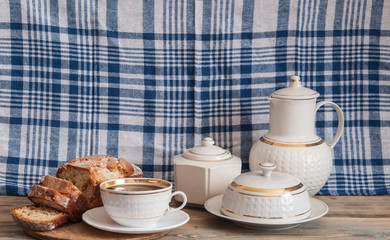 Coffee and cakes on a wooden table background