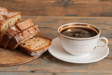 Coffee and cakes on a wooden table background