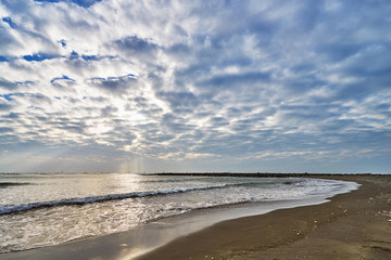 Beautiful scenics of Qiaotou Beach with flowing clouds and waves from the south china sea at Qiaotouhaitan park in Tainan, Taiwan.