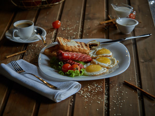 Fried eggs with sausage.