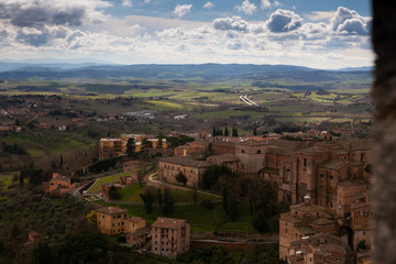 Fototapeta na wymiar Top view of the famous Italian city of Siena on a cloudy day