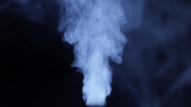 working a humidifier with a blue circular light