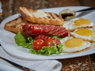 Fried eggs with sausage.