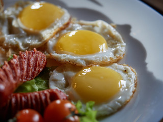Fried eggs with sausage.