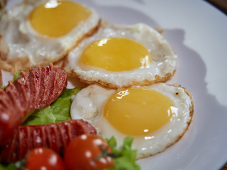 Fried eggs with sausage.