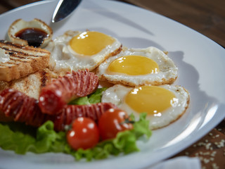 Fried eggs with sausage.