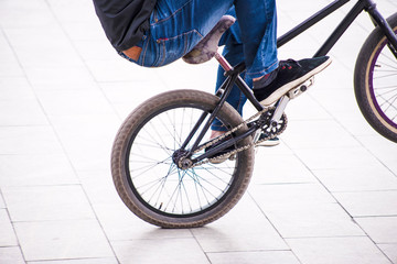 Naklejka premium Kyrgyzstan. the city of Bishkek. March 10, 2019. Young people, teenagers resting, cyclists on the streets.