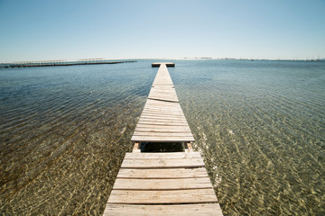 Fototapeta premium Wooden pier in the Mar Menor for light boats in Murcia, Spain