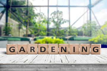 Gardening sign in a green house on a wooden