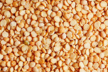 Background texture of pea porridge golden color in full-frame form. View from above. Close-up