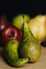 Fresh pears. Pears harvest. Fruit background. Fresh organic pears on old sacking. Nature concept. Dark mood. Close up.