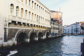 Naklejka premium Grand Canal in Venice on a sunny day, Italy. Venice in the sunlight. Scenic panoramic view of Venice in winter. Cityscape and landscape of Venice. Romantic water trip.