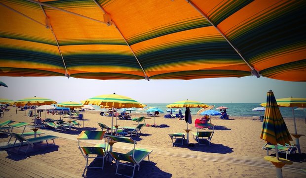 under parasol on the sunny beach