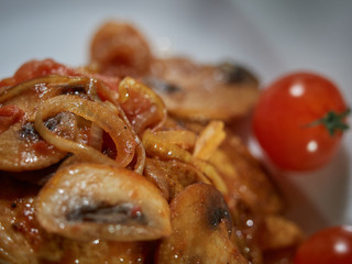 Fresh beef with fried mushrooms.