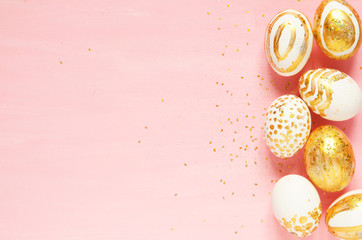 Top view of easter eggs colored with golden paint in differen patterns. Copy space. - Image