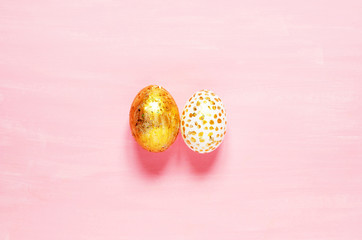 Top view of easter eggs colored with golden paint in differen patterns. Copy space. - Image