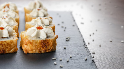 Baked rolls with a hat on a slate Board. Copy space