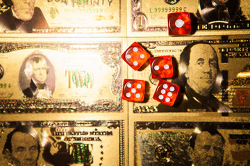 Casino red dices on gaming table US Dollar bills background