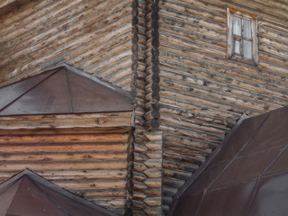 Christian wooden temple closeup. Christian church. Orthodox. Log building. Architectural background. Wooden texture. Ust-Kamenogorsk (Kazakhstan)