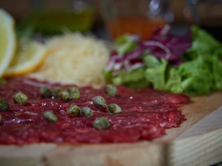 Carpaccio with meat sauces.