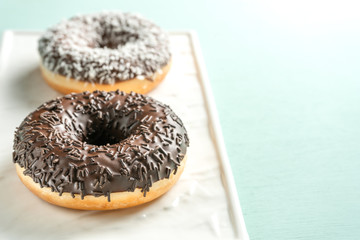 Donuts on a white stand, copy space.