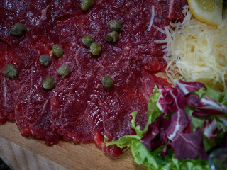 Carpaccio with meat sauces.