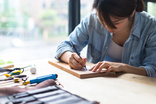 Female carpenter working in studio