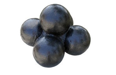 A pyramid of black cannonballs on a white