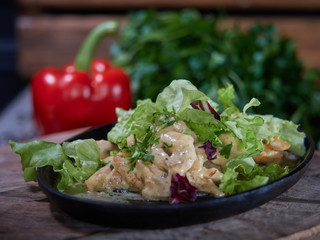 Portion of meat sprinkled with white sauce.