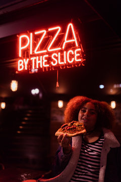 pizza by the slice sign