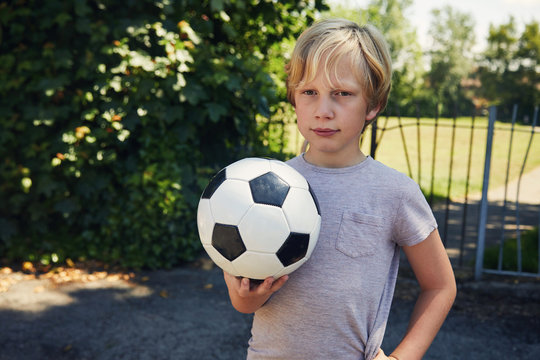 Child holding a football