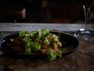 Portion of meat sprinkled with white sauce.