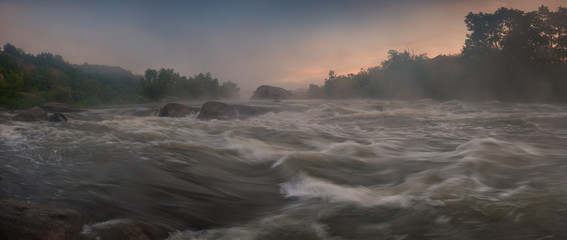 Panorama with bank of river in morning fog