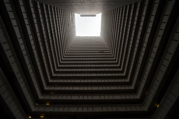 Squared residencial building photograph from the courtyard in Hong Kong