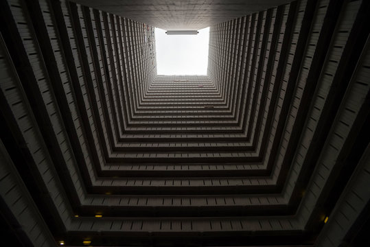 Squared residencial building photograph from the courtyard in Hong Kong