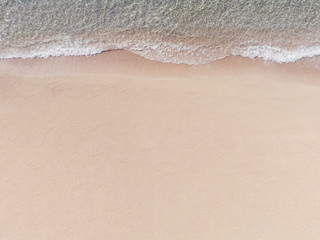 Fototapeta na wymiar Aerial View of Sandy Beach and Vlue Sea with Wave
