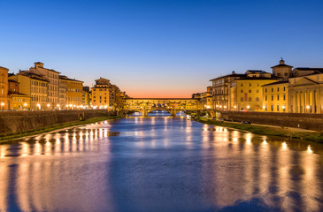 Arno River - A panoramic dusk view of Arno River at the Ponte Vecchio "Old Bridge" in the heart of Florence, Tuscany, Italy.