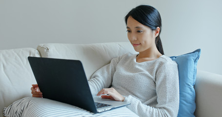 Woman work on laptop computer at home