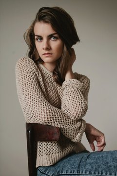 Confident young woman posing indoors